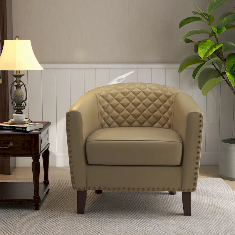 Fauteuil rond en cuir PU avec clous décoratifs