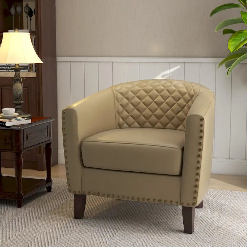 Fauteuil rond en cuir PU avec clous décoratifs