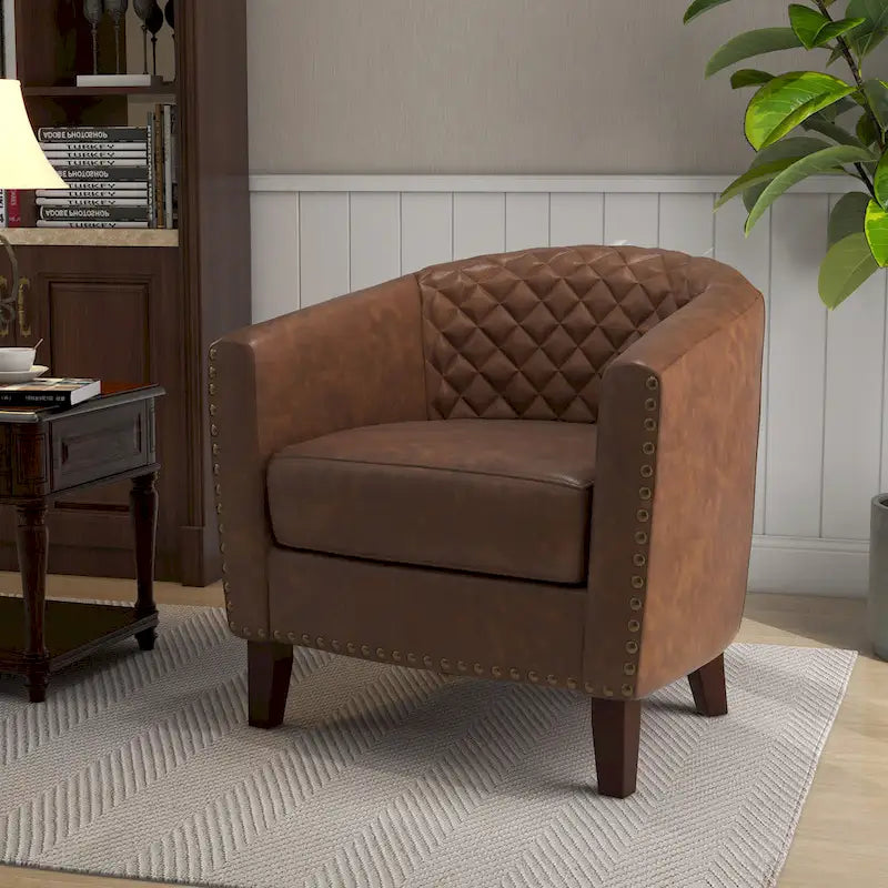 Fauteuil rond en cuir PU avec clous décoratifs